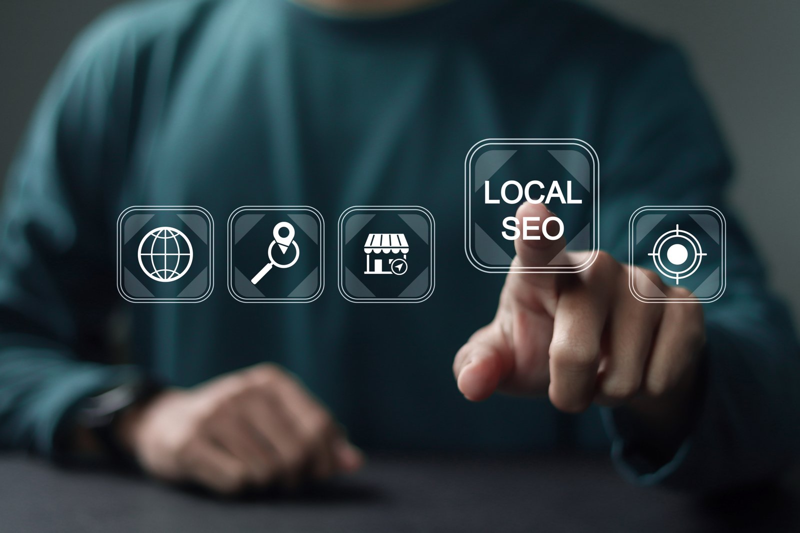 Local SEO concept. Optimizing a website in order to increase traffic, Businessman touching local SEO icon on virtual screen for leads and brand awareness from local search. Local SEO icon highlighted among other digital icons, suggesting online visibility for local businesses.